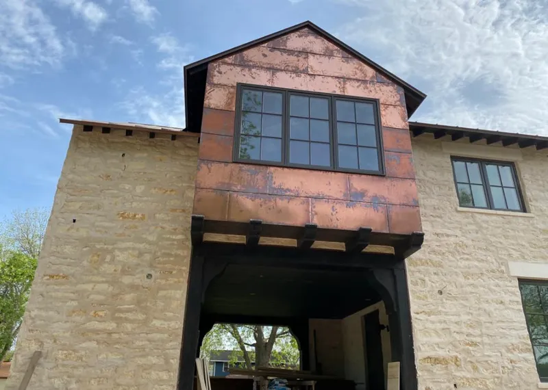 Copper metal panel facade on a stone building for Skylight Installation in Miamisburg