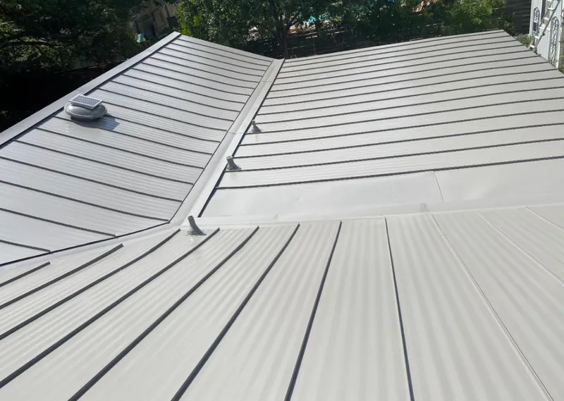 Solar attic fan installed on a metal roof for Roof Ventilation in Miamisburg